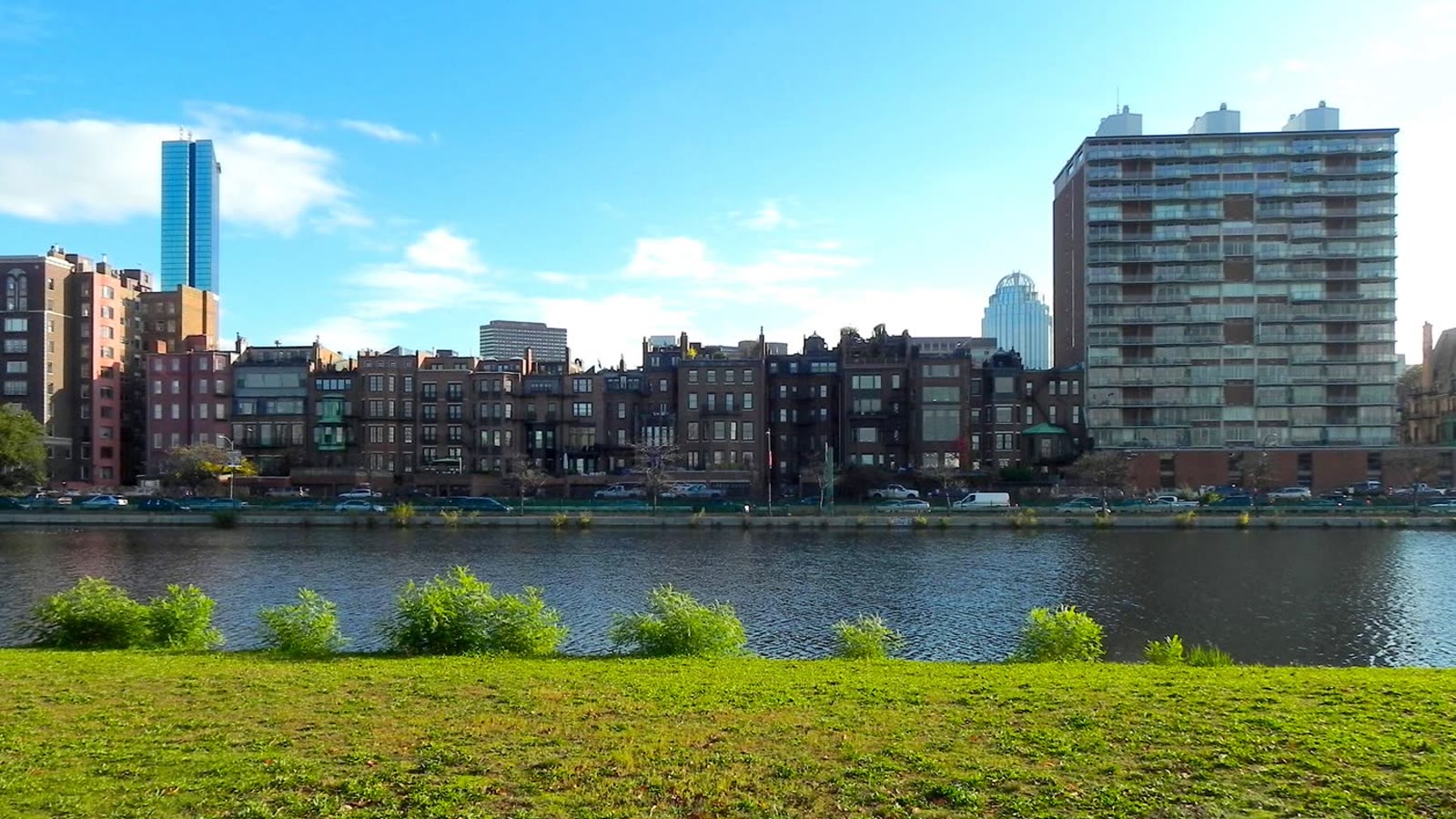 Three clocks on mortgage paperwork for home buyers: moving boxes packed for a new home in Greater Boston